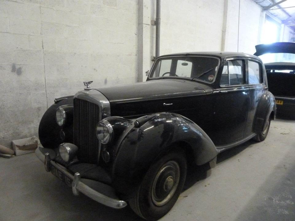 A classic black saloon in the workshop