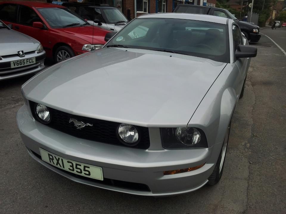Silver Ford Mustang finished, parked outside
