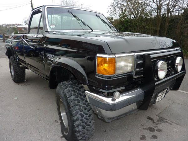 The finished pickup in gloss black, front three-quarter view